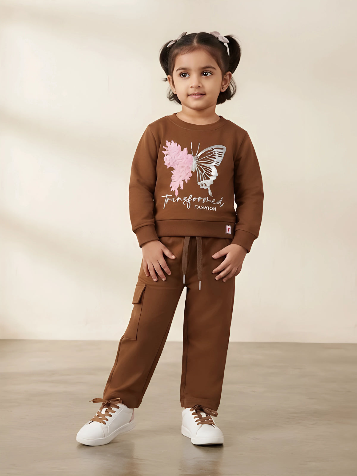 Girls brown butterfly print coordinate set with sweatshirt and cargo pants.