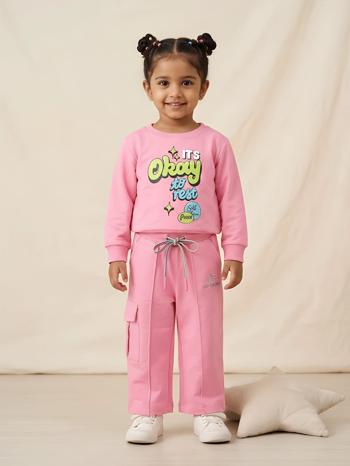 Pink graphic print sweatshirt and shorts girls coordinate set.