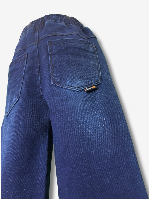 Boys' dark navy blue denim jeans in a straight-leg cut, featuring a gathered elastic waistband and a khaki web belt with a silver buckle.
Export to Sheets
