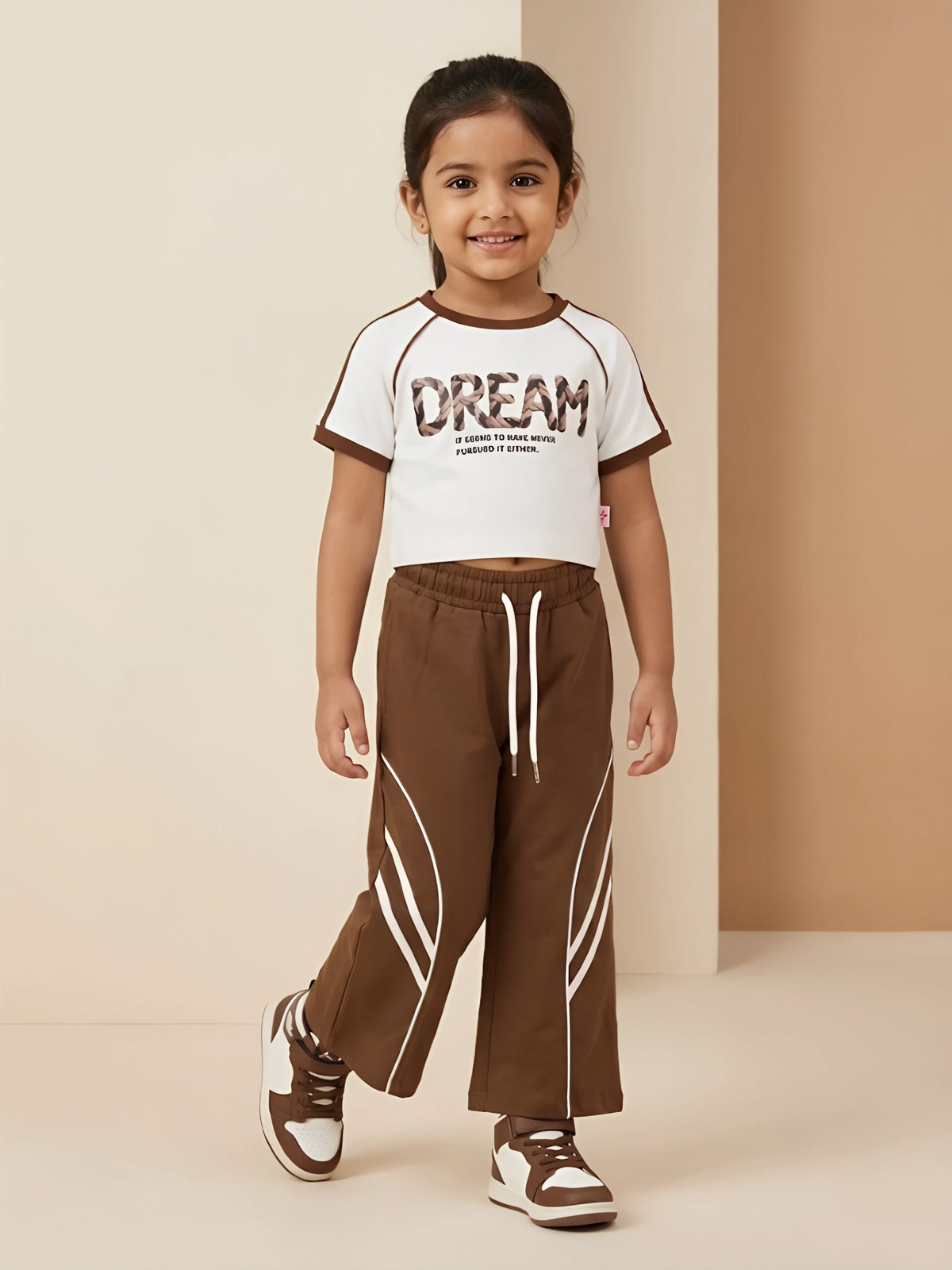 Girls brown typography print t-shirt and matching pants coordinate set.