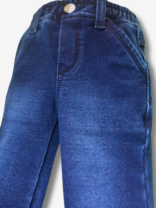 Boys' dark navy blue knit jogger pants with a gathered elastic waistband, cuffed ankles, and structured paneling at the knees.
Export to Sheets