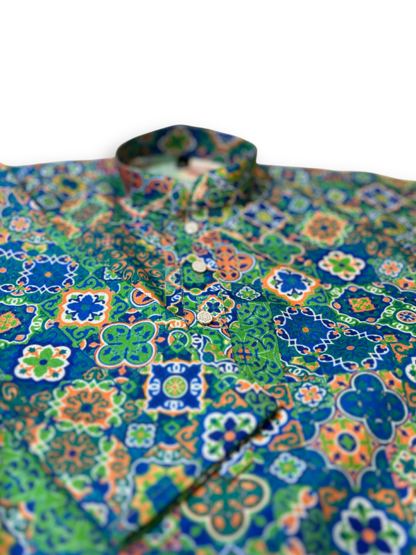 Boys' long-sleeved kurta with a dense, colorful geometric mosaic print in shades of blue, green, yellow, and orange, shown with plain cream pyjama pants.
Export to Sheets