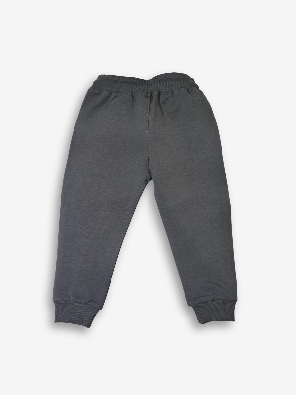 Boys' dark charcoal grey jogger pants with an elastic waist, cuffed ankles, and a visible speckled grey and white rope drawcord.
Export to Sheets