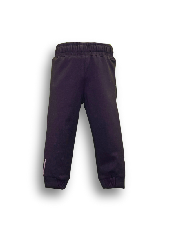 Close-up view of a pair of solid black fleece boys' track pants/joggers with a wide elastic waistband, cuffed ankles, and a small pink vertical graphic on the lower leg.