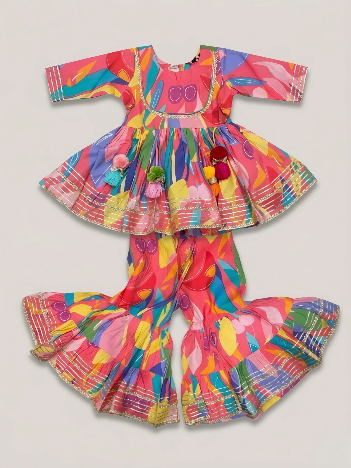 Girls Peach Printed Ethnic Sharara Set with Tassels.