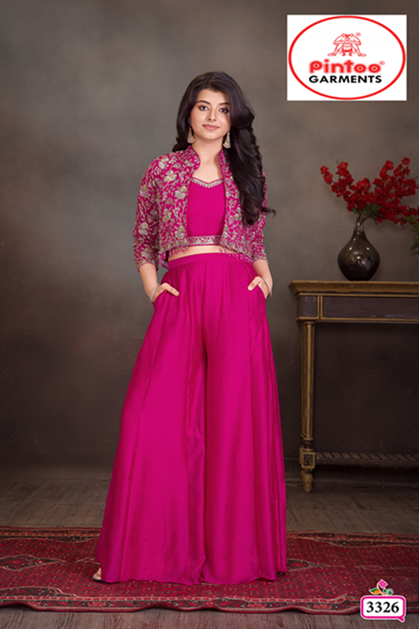 Young woman/girl wearing a three-piece bright rani pink ethnic set featuring a long, wide-leg palazzo, crop top, and open, cropped jacket with green and gold floral embroidery.
Export to Sheets
