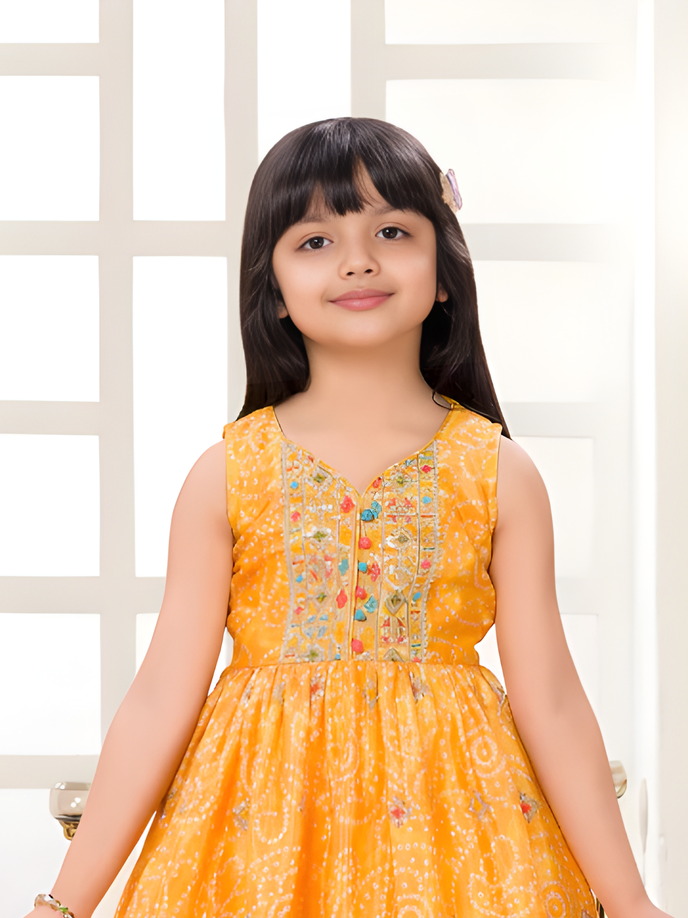 Girls Sleeveless Yellow Bandhani Print Peplum Top and Patiala Suit