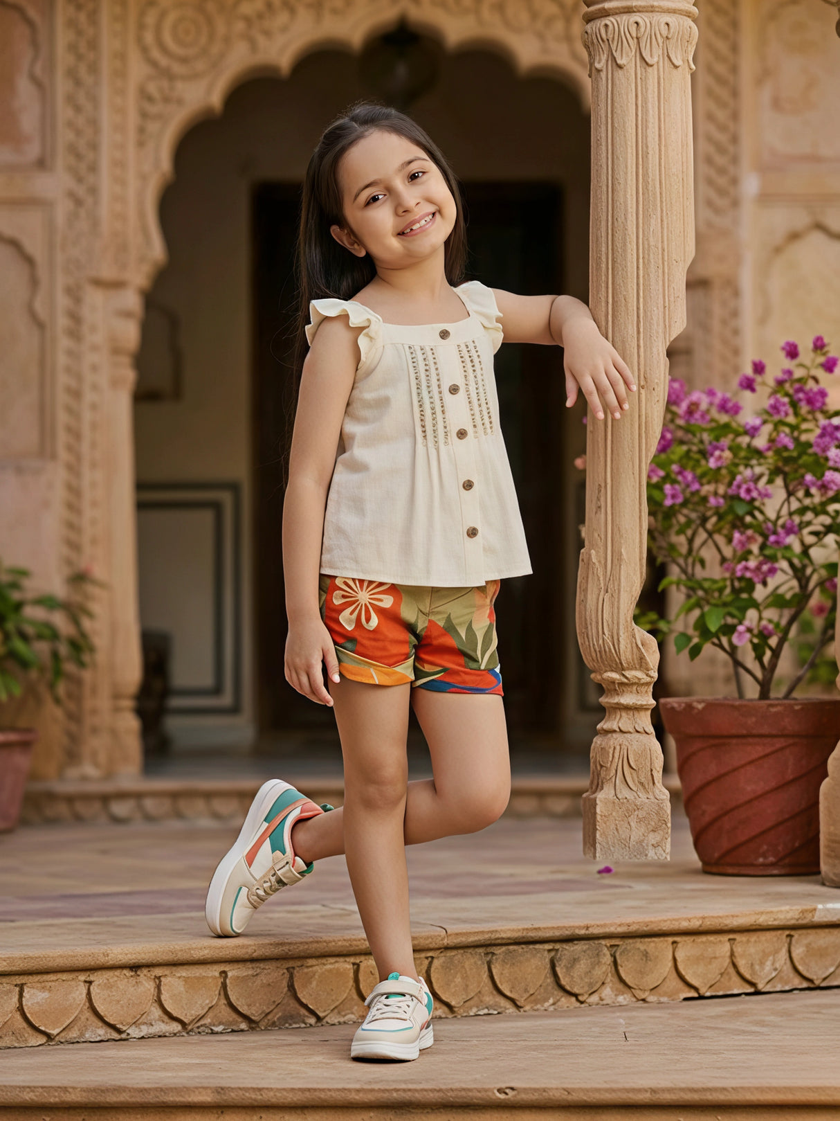 Girls Cream Ruffle Top & Floral Print Shorts Two-Piece Set.