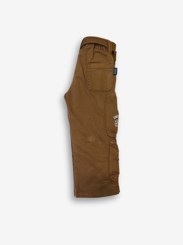 Boys' rustic brown cargo pants with many zippered side pockets, a matching web belt, and cuffed or slightly cropped leg openings.
Export to Sheets