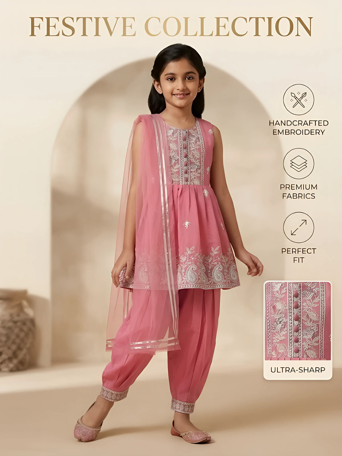 Girls pink ethnic outfit featuring a sleeveless embroidered short tunic kurta, pleated dhoti pants with embroidered cuffs, and a matching sheer dupatta.