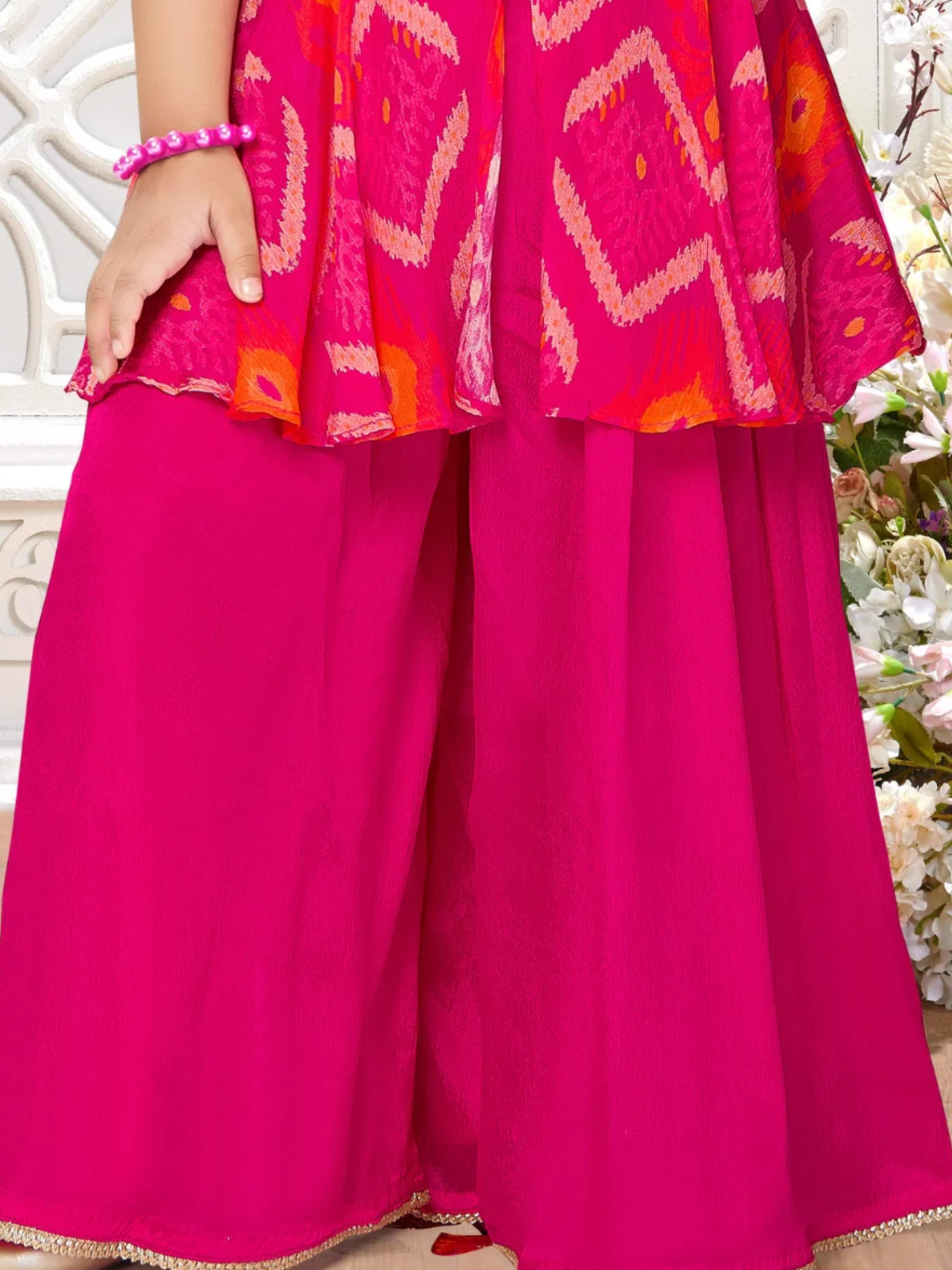 Girls' Vibrant Rani Pink Sharara Suit with Embroidered Peplum Top.