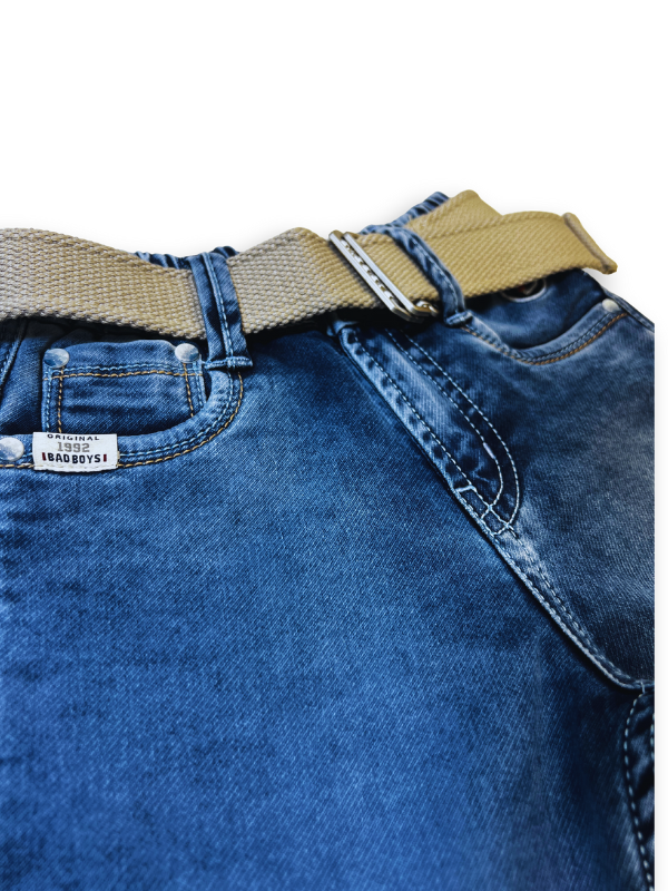 Boys' light blue wash denim jeans with a slightly faded look, an elastic waist, and a thick tan web belt with a silver rectangular buckle.
Export to Sheets