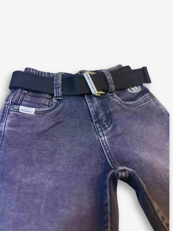 Boys' dark grey/black wash denim jeans with a slightly faded look, an elastic waist, and a thick black web belt with a rectangular silver buckle.
Export to Sheets