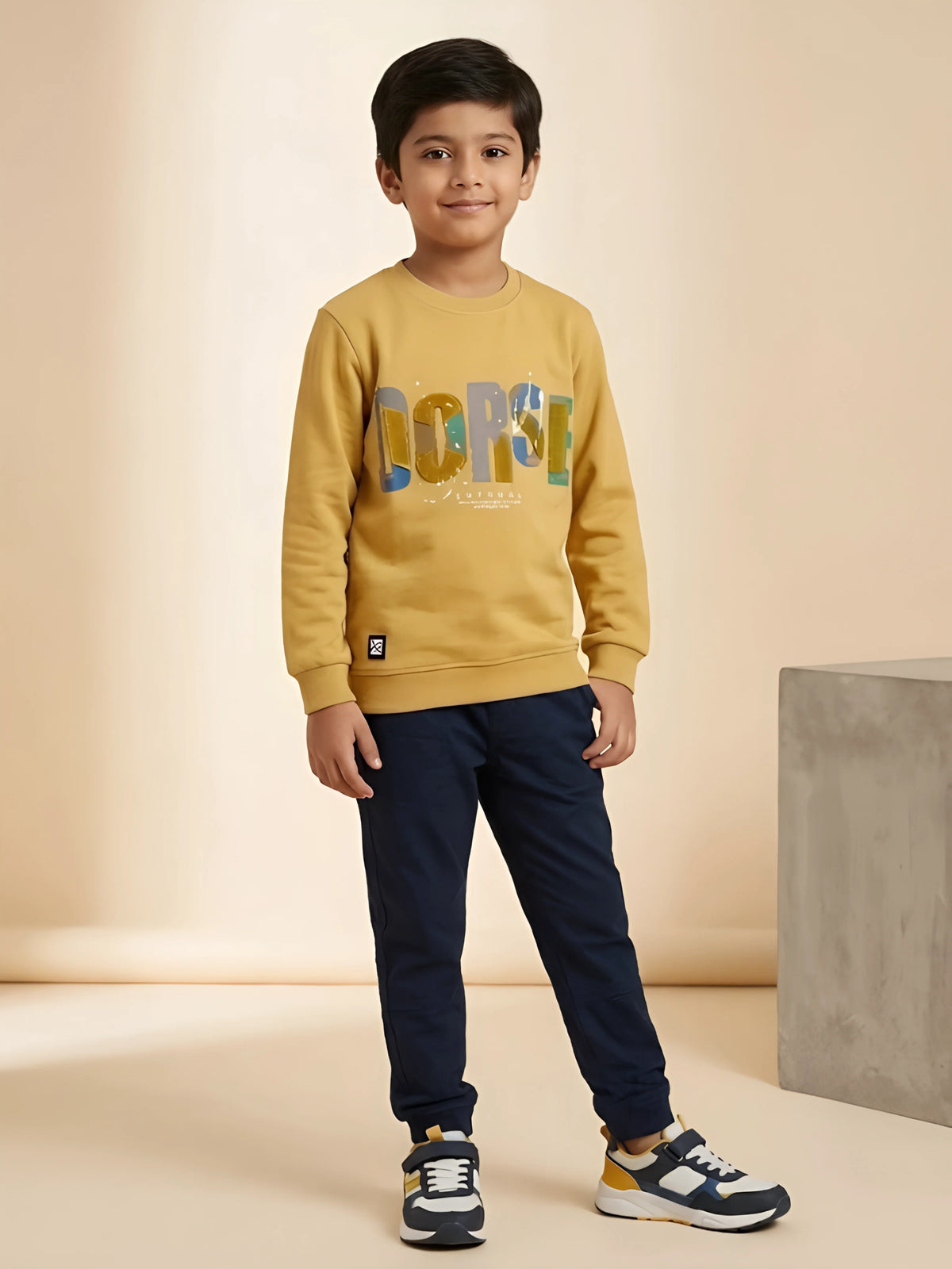 Yellow graphic print t-shirt for boys with colorful lettering and paint splatter details