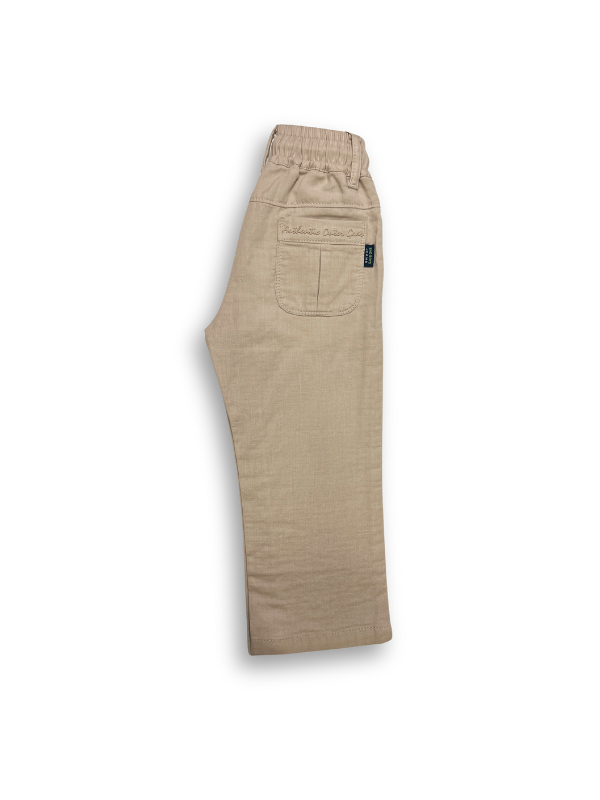 Boys' cream or pale khaki casual trousers with a comfortable elastic waistband, straight leg, and a thick, multicolored contrast rope drawstring.