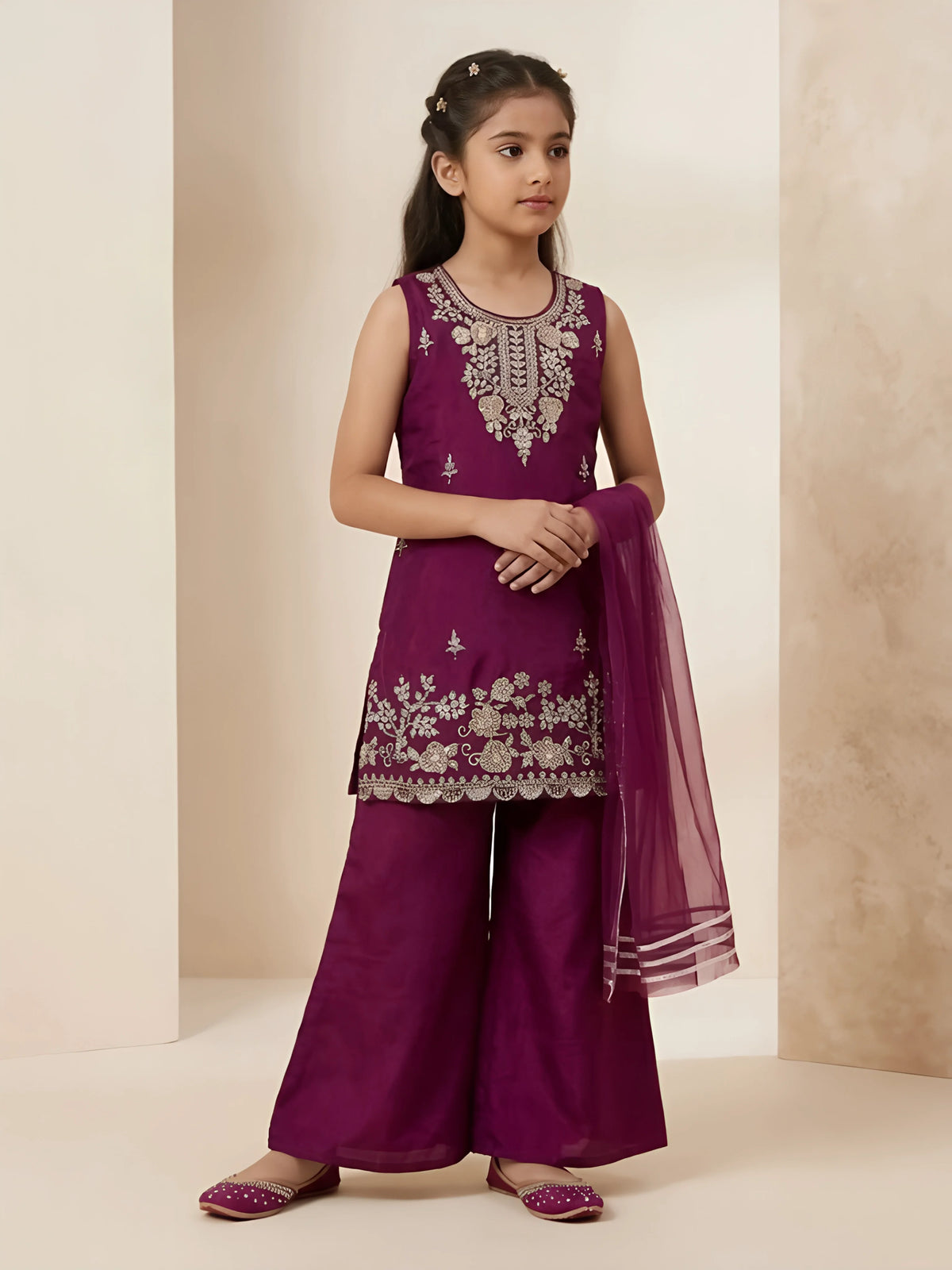 Girls wearing purple sleeveless embroidered kurta with matching palazzo pants and mesh dupatta