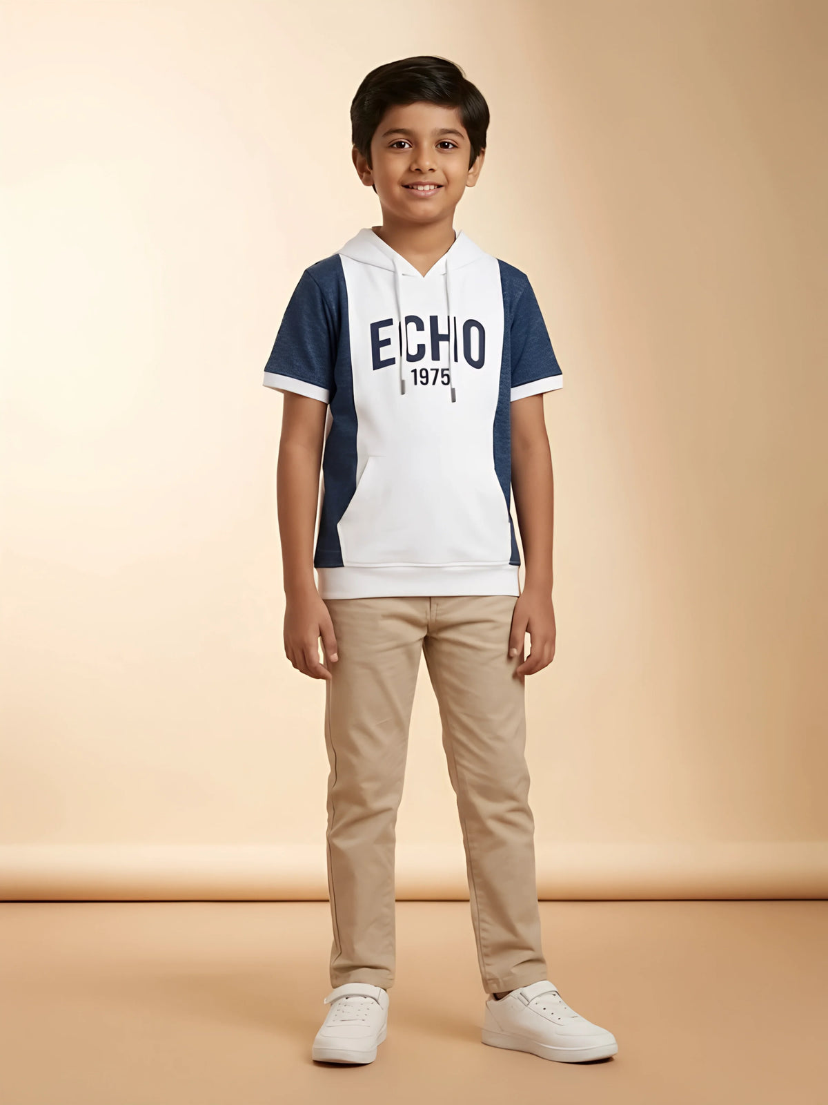 Young boy wearing a white and blue colorblock hooded short sleeve casual t-shirt with ECHO print and front kangaroo pocket