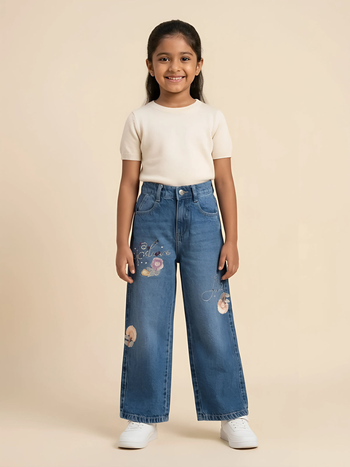 Young girl wearing stylish blue wide-leg casual pants with subtle floral prints and belt loops