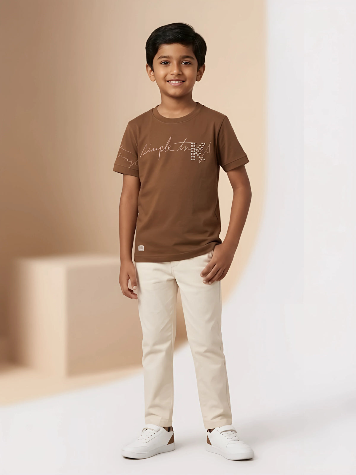 Boys brown short sleeve crew neck t-shirt with script graphic print on the front