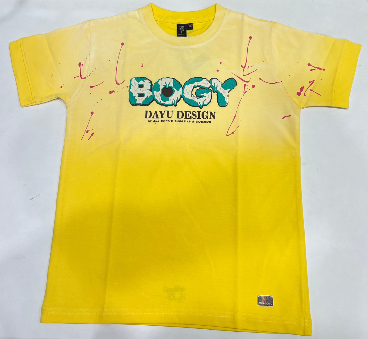 Vibrant yellow boys' short-sleeve T-shirt with an ombre fade, featuring a central "BOGY" graphic with teal outline and scattered pink paint splatters