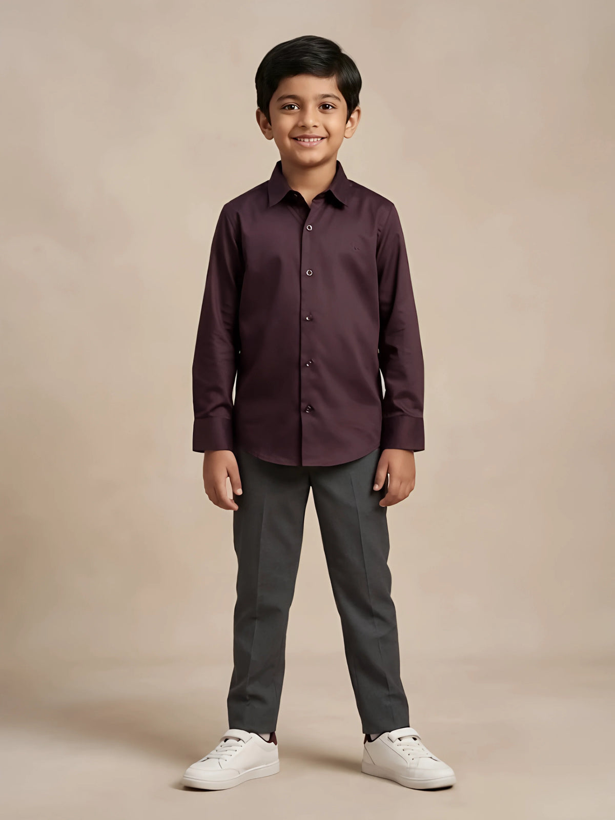 Young boy wearing a solid dark purple full sleeve casual shirt paired with trousers