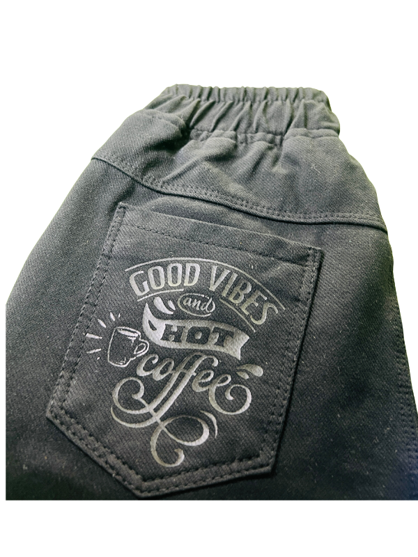 Boys' plain black denim jeans in a straight-leg style, featuring a gathered elastic waistband and a black web belt with a gold rectangular buckle.
Export to Sheets