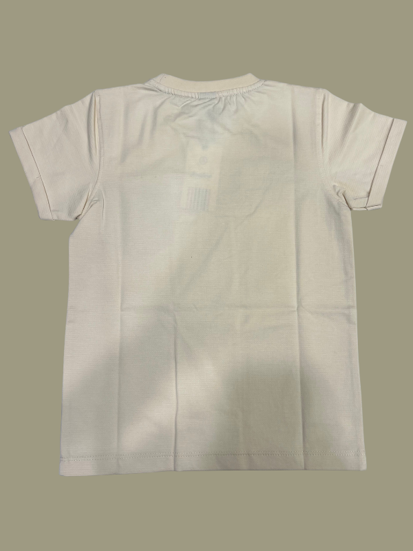 Cream/Beige boys' short-sleeve T-shirt with subtle horizontal texture, featuring the motivational text "JUST DON'T GIVE UP" and a solid black patch pocket on the chest