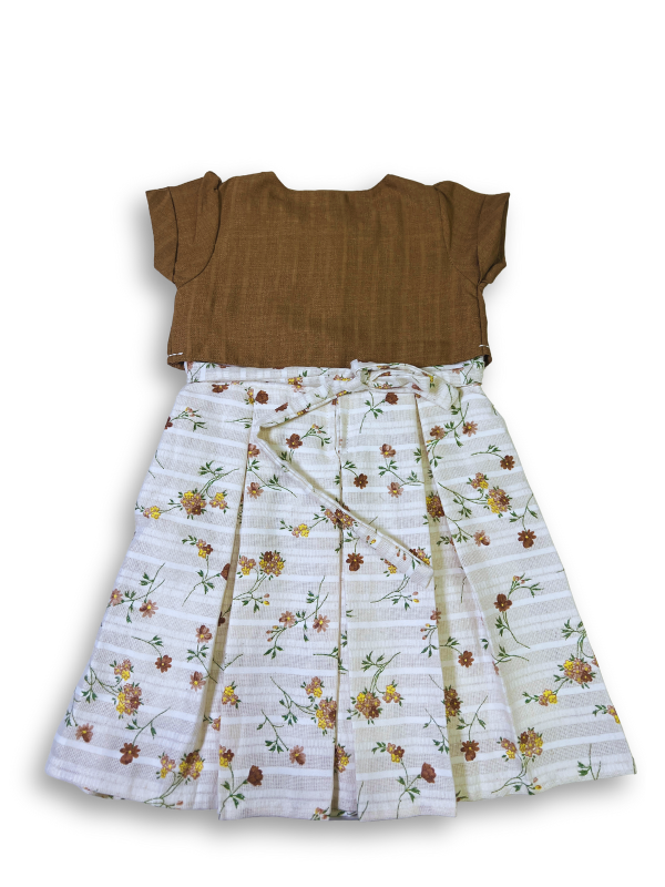 Girls' two-piece outfit featuring a brown textured bolero jacket with embroidery over a white and beige striped floral print dress with pleats.
Export to Sheets