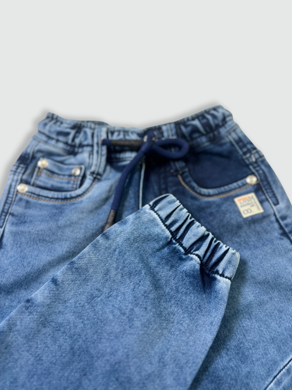 Boys' dark blue/navy fleece joggers with a neon yellow drawstring, a side zipper pocket, and a small athletic badge on the leg.