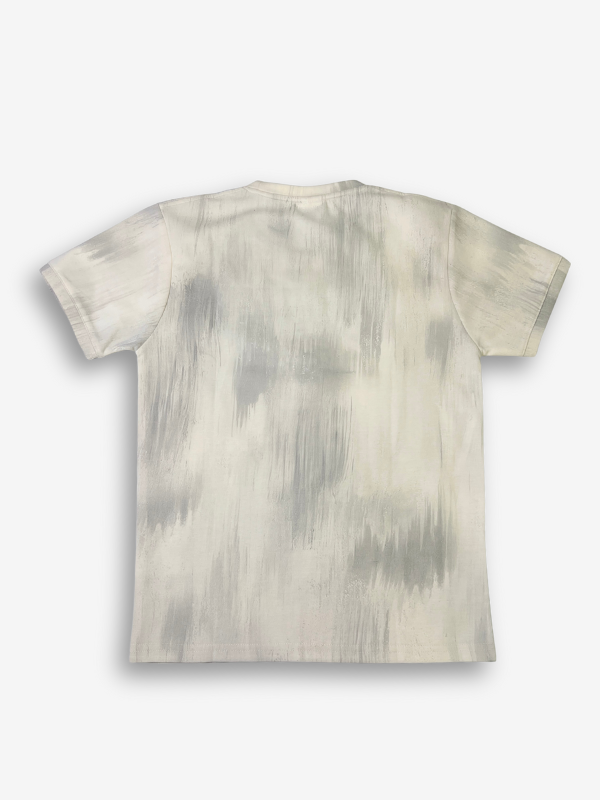 Off-white/cream boys' long-sleeve sweatshirt with a vibrant pink, green, and blue airbrushed graphic on the chest, featuring the neon script text "yes Tough Bnt"