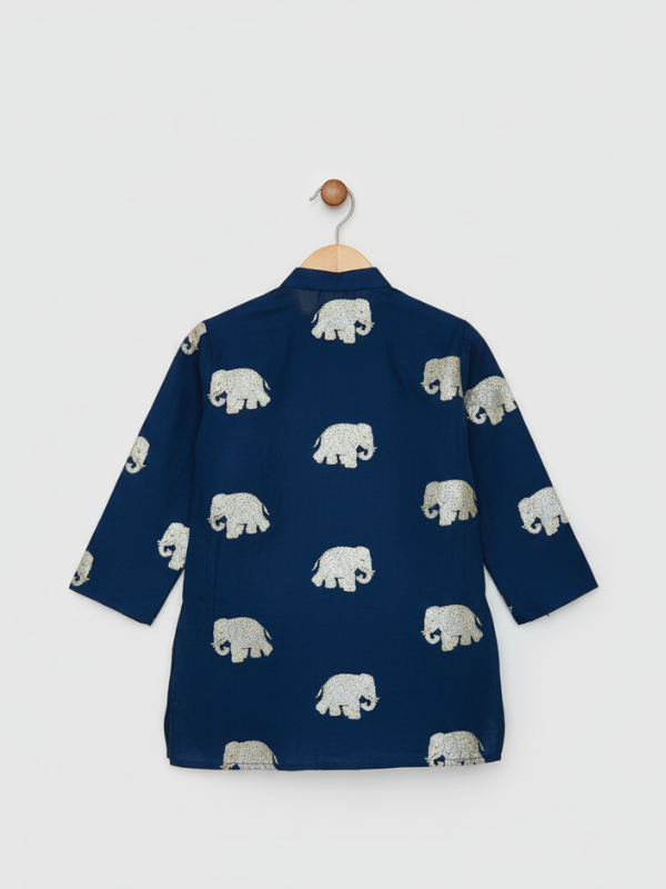Boys' navy blue full-sleeve kurta with an all-over, repeating metallic silver elephant print, shown hanging on a hook. The ethnic top is suitable for festive occasions