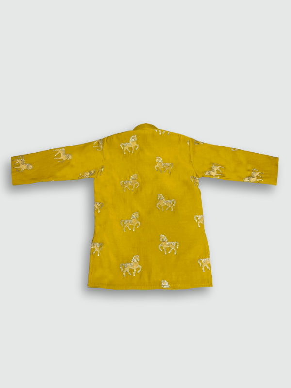 Boys' bright Haldi yellow full-sleeve kurta featuring a repeating gold embroidered horse motif, paired with solid white straight-fit pajama bottoms. The ethnic set is shown against a plain background