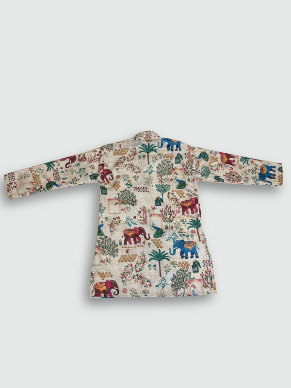 Boys' full-sleeve cream/off-white kurta featuring a colorful, all-over print of traditional Indian motifs including elephants, peacocks, and trees. The ethnic set is completed with solid white straight-fit pajamas