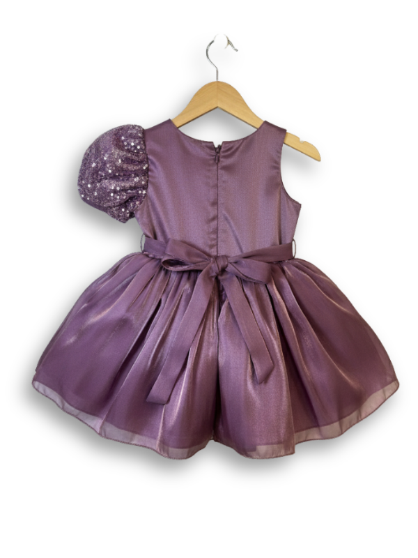Mauve girls' one-shoulder party frock on a hanger, featuring a puff sleeve, a silver sequin zebra-print bodice, a large mauve flower, and a voluminous satin skirt.