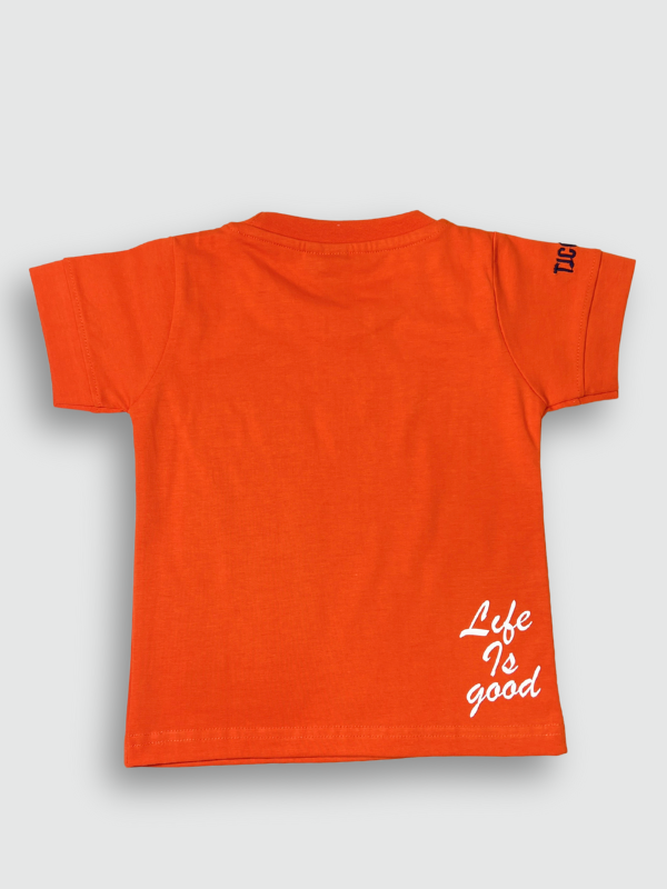 Vibrant orange boys' short-sleeve T-shirt featuring a large white and red graphic print that reads 'DESIRE' and 'For Success Full Living'.