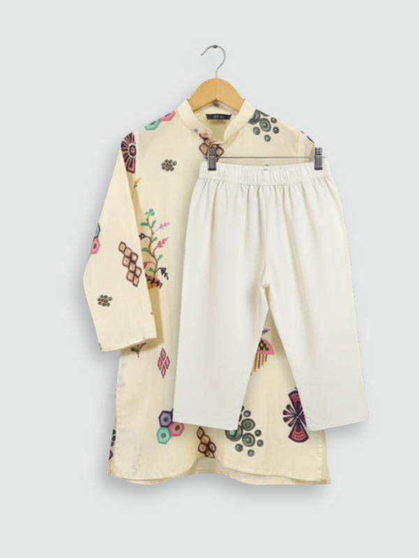 Boys' cream colored kurta with colorful all-over print of geometric and floral motifs, hanging on a wooden hanger.