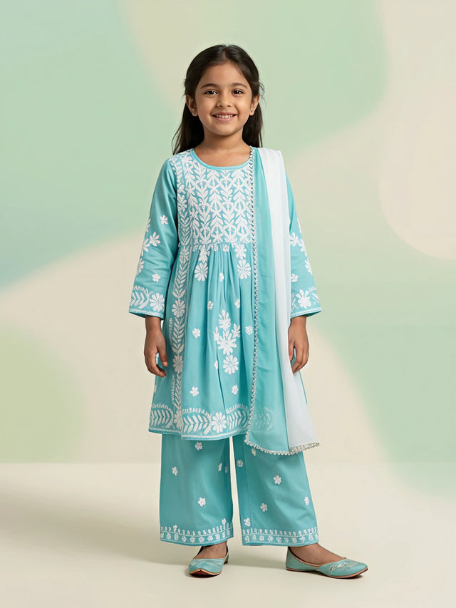 Young girl wearing a sky blue Chikankari embroidered short kurta palazzo set with white dupatta