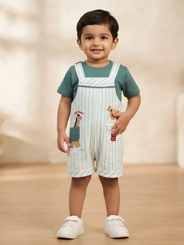Infant boy wearing a green round-neck t-shirt and light green striped dungaree shorts with front pockets and animal patches.