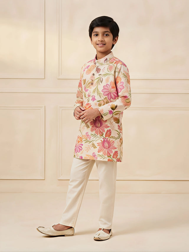 Cream floral printed kurta pajama set for boys with mandarin collar and full sleeves.