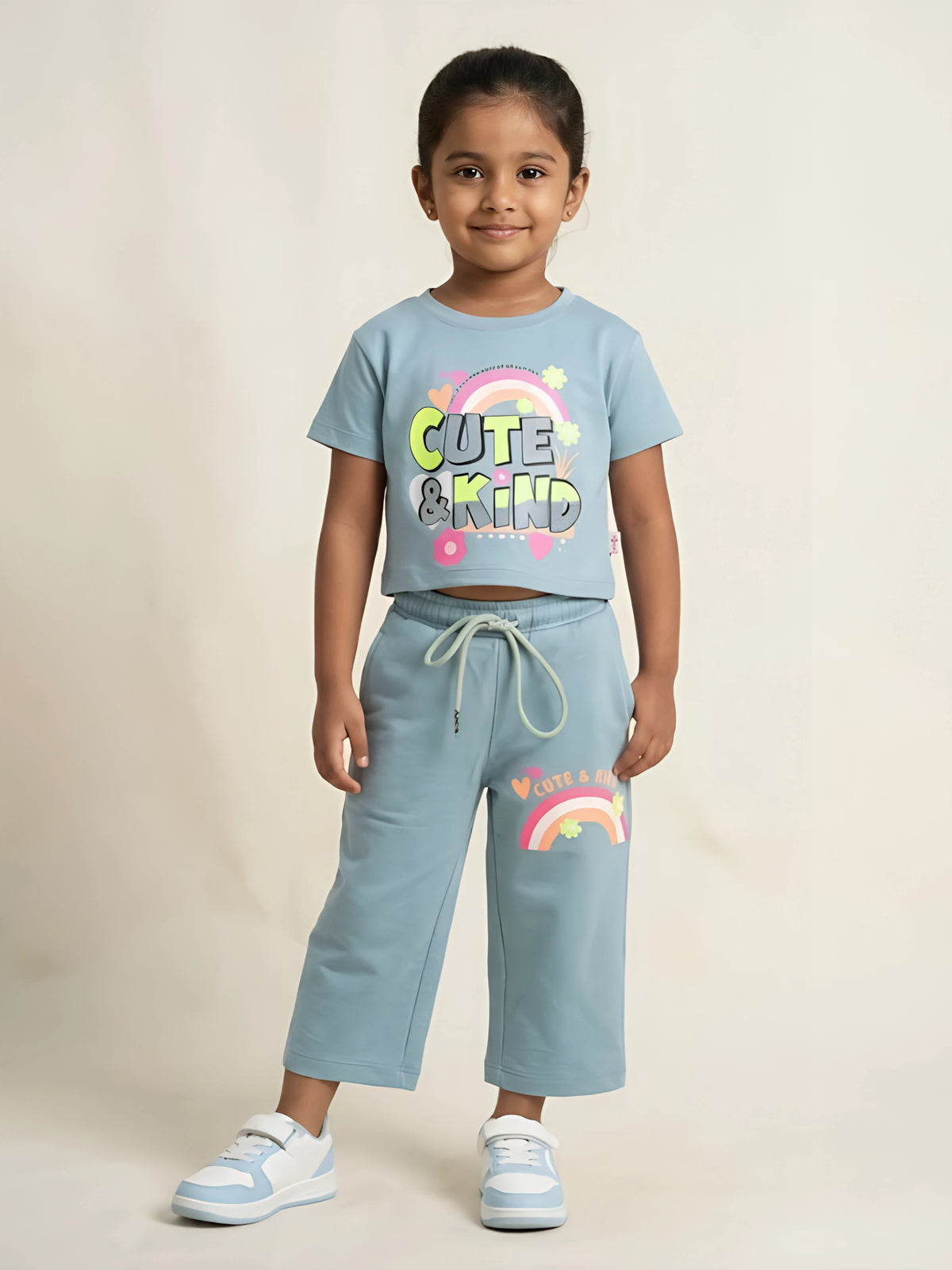 Green cute and kind graphic print girls coordinate set with matching top and shorts.