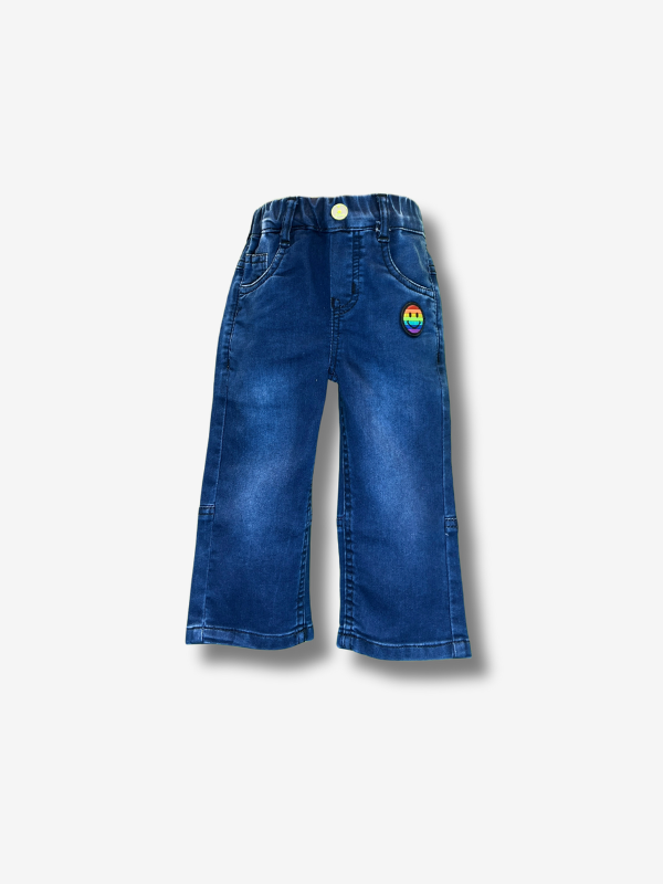 Boys' dark blue wash wide-leg denim jeans with a gathered elastic waistband and a colorful rainbow smiley face patch on the left side.

Export to Sheets