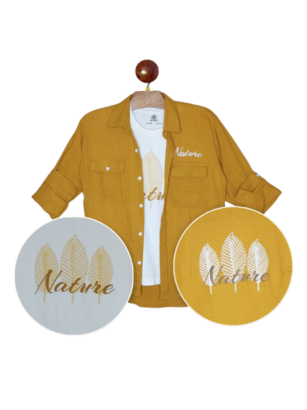 Boys' casual outfit featuring a mustard yellow shirt/shacket worn open over a white T-shirt with a gold-foil feather print, and the shirt has roll-up sleeves and chest pockets.