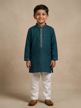 Young boy wearing a dark teal green full-sleeve kurta with striped mandarin collar detail and white pyjama pants
