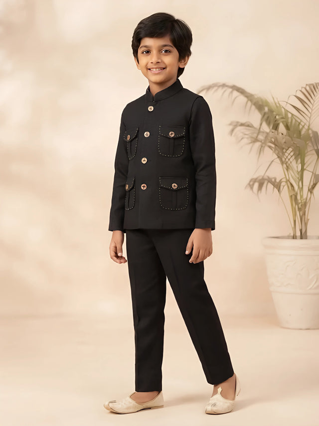 Boys black solid Jodhpuri style kurta pajama set with button details.