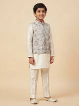 Cream embroidered kurta pajama set for boys with intricate floral patterns.