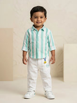 Young boy wearing a sea green and white vertical striped shirt with white trousers co-ord set