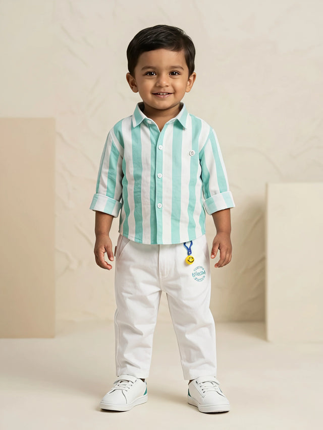Young boy wearing a sea green and white vertical striped shirt with white trousers co-ord set