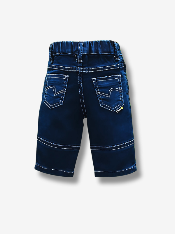 Boys' dark indigo blue denim jeans with a wide knit fabric waistband, silver belt buckle, and a hanging logo charm.

Export to Sheets
