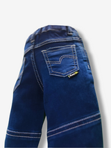Boys' dark indigo blue denim jeans with a wide knit fabric waistband, silver belt buckle, and a hanging logo charm.

Export to Sheets