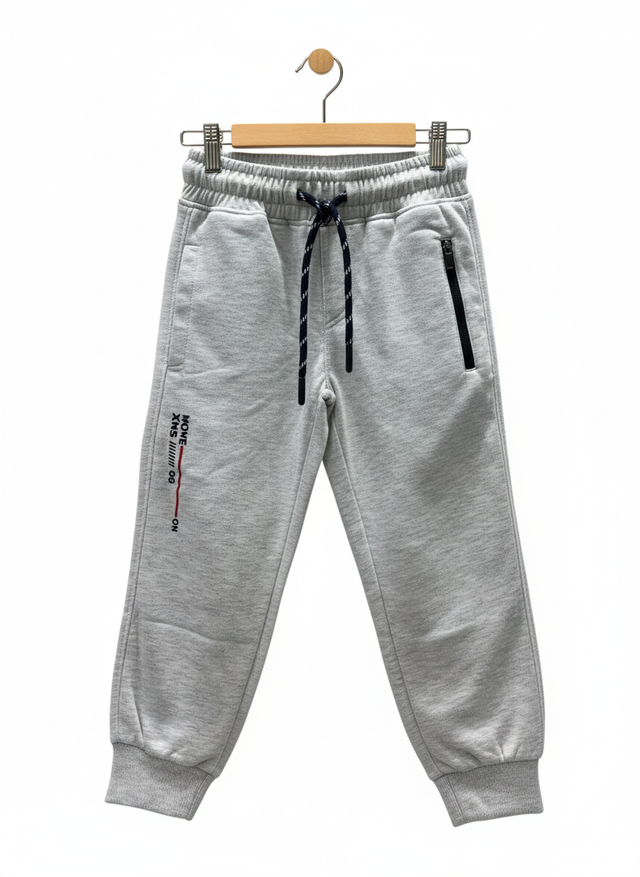 A pair of boys' light grey fleece jogger track pants with an elastic waist, navy and white contrast drawstring, ribbed ankle cuffs, and a vertical zippered pocket.